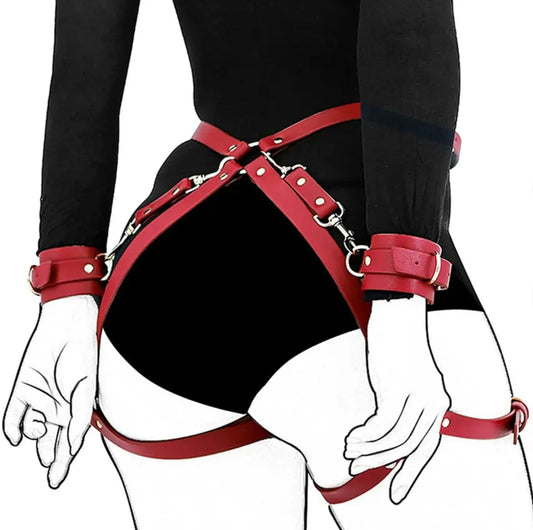 Leather handcuffs with garter and leg straps.